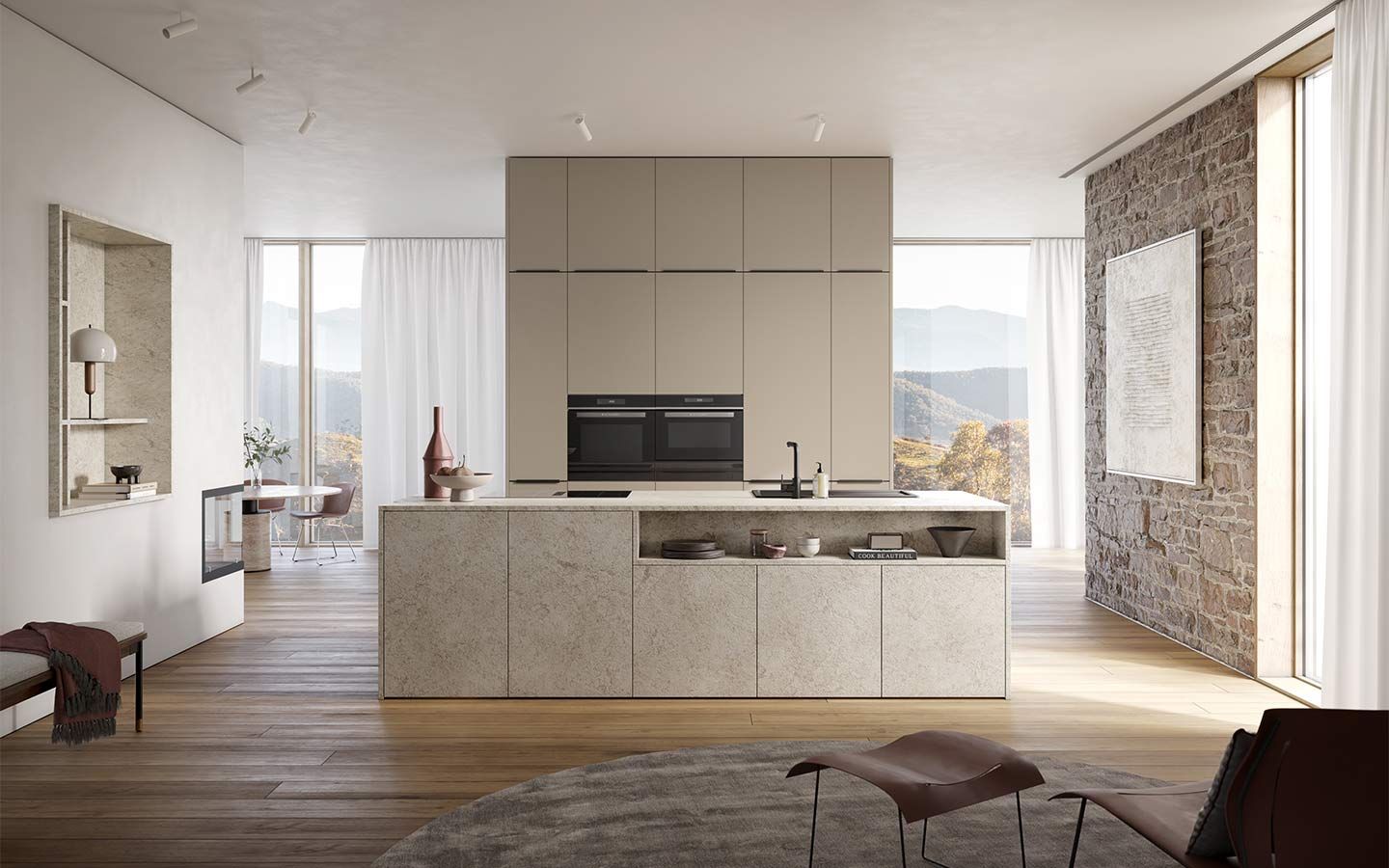 Küche in Steinoptik Eine offene Küche mit Steinverkleidung steht neben einer Naturstein-Wand vor bodentiefen Fenstern