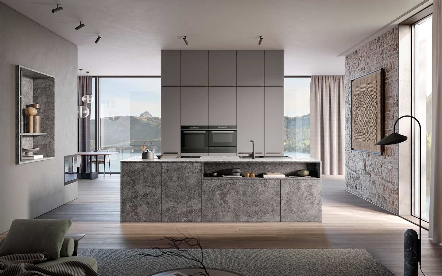 Offene Küche mit Steinwand Eine moderne Küche mit Bodentiefen Fenstern und Kochinsel mit Steinoptik sowie Übergang zum Wohnbereich